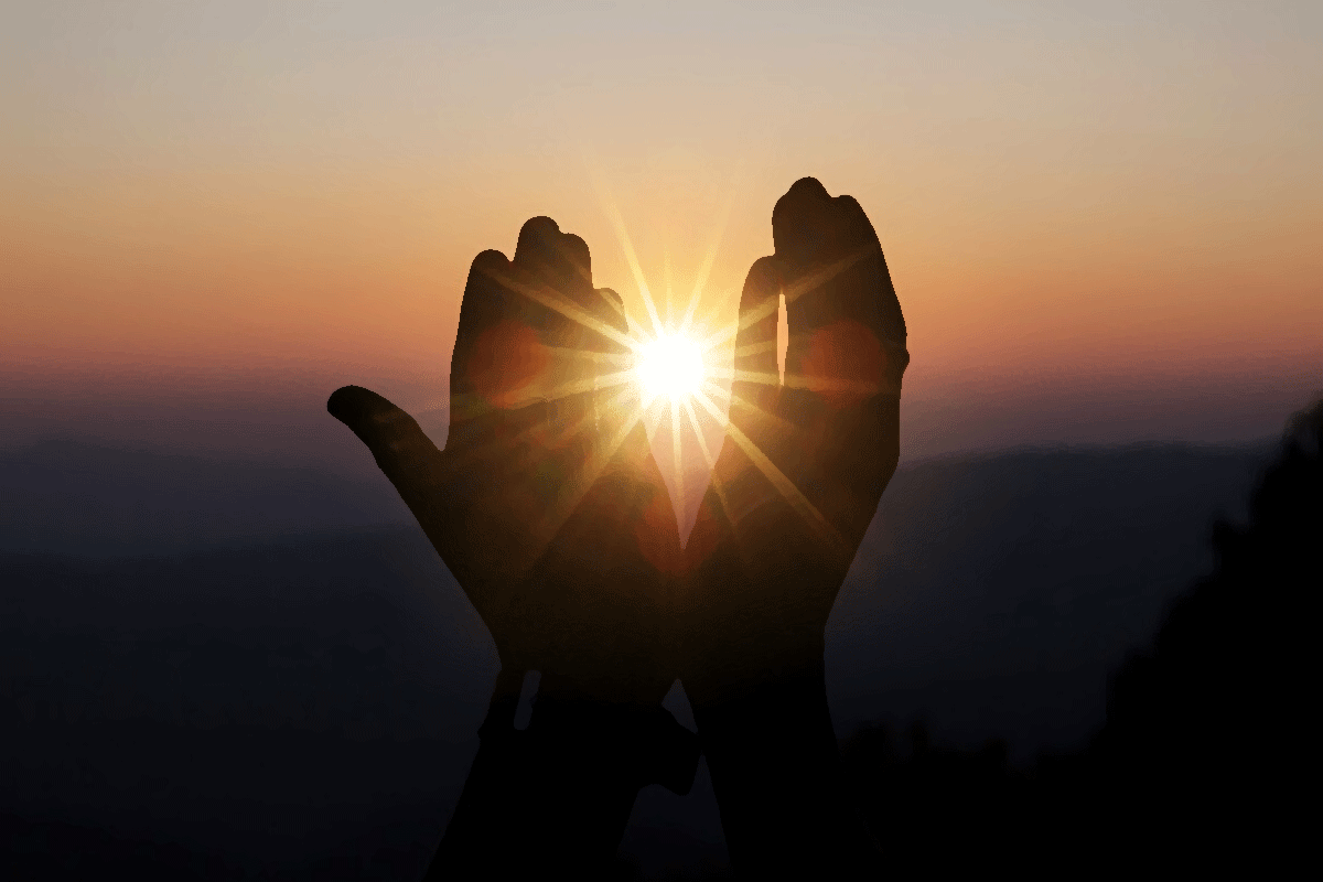 Praying hands with sunlight for Bible Verses About Light
